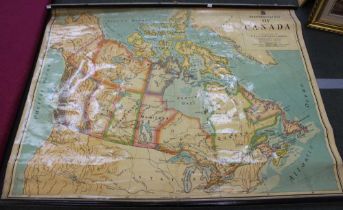 A rolling wall map, "Dominion of Canada", constructed by W & A.K. Johnston Ltd, Geographers, Eng