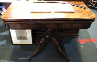 A Regency mahogany foldover card table, on fluted stem with four supports having brass castors, 91cm