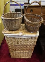 Woven wicker laundry basket and two shopping baskets