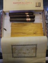 Various pipes, pipe boxes and cigar boxes with a few cigars.