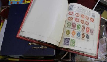 A quantity of stamps, some loose, some albums and cigarette cards