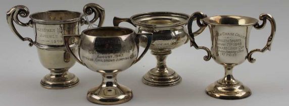 A collection of four mid-twentieth century silver trophy cups, various hallmarks, engraved, combined
