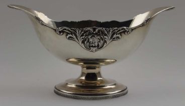 Cooper Brothers and Sons Limited, a silver fruit bowl centrepiece, of boat form, raised on oval plat