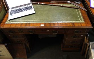 An Edwardian mahogany twin pedestal desk with leather top, fitted nine drawers, 120cm wide