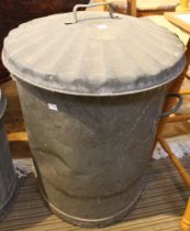 A vintage galvanised dustbin with lid