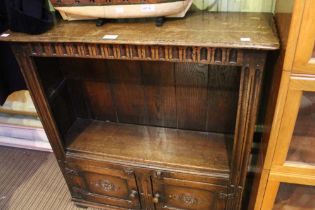 An Old Charm style open book shelves with cupboard below