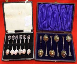 Two cased sets of silver spoons