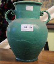 C.H. Brannam of Barnstable - An Arts & Crafts pottery twin-handled vase, with running green glaze ex