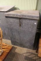 A galvanised feed bin with lift up lid