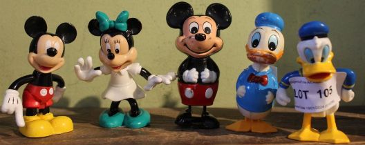 A collection of five Walt Disney cartoon characters, comprising two Mickey Mouse, one Minnie Mouse a