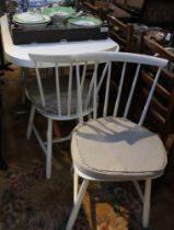 "Farstrup" four white painted kitchen chairs with a white kitchen table on chrome support