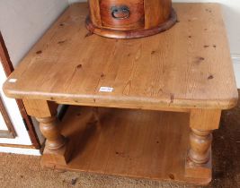 A low square pine coffee table