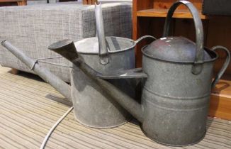 Two vintage metal watering cans