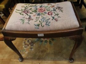 A dressing table stool with wool work seat