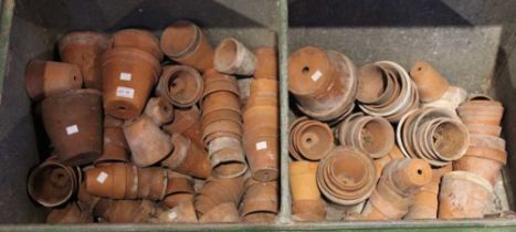 A large quantity of old terracotta garden flower pots