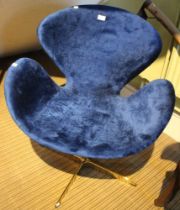 A modernist design office swivel chair in blue fabric upholstery on brass frame