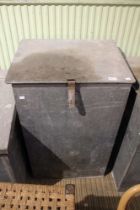 A galvanised feed bin with lift up lid and contents