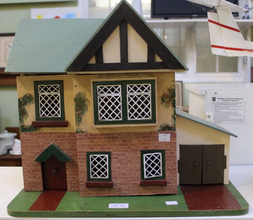 A wooden scratch built dolls house in the 1930's style