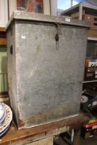 A galvanised feed bin