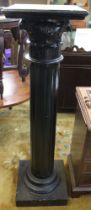 A black painted wooden column plant stand