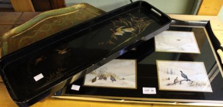 A large lacquered tray depicting game birds with two other examples