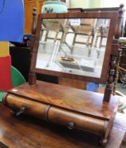 A Victorian walnut veneered toilet swing mirror over two small drawers