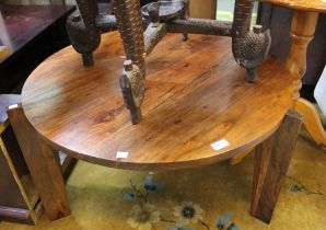 An imported hardwood low circular coffee table