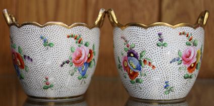 A pair of Spode pots, with scalloped rims and gilt handles, polychrome floral decoration, on a white
