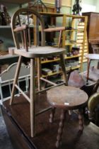 A child's high chair together with a three legged child's stool