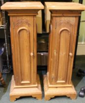 A pair of pine cupboards fashioned as plant stands