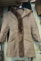 A vintage ladies sheepskin jacket with hood