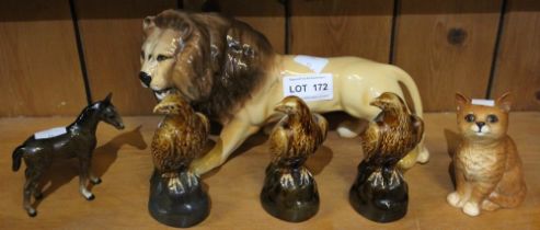 A Beswick Lion. together with a Beswick Kitten, small horse and three small Eagle Whisky decanters (
