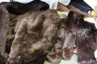 Two fur coats with a faux fur large throw