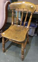 A 19th century elm spindle back country chair