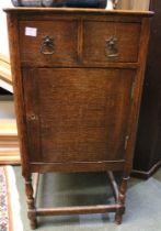 Early 20th century oak bedside cupboard with two drawers and cupboard below