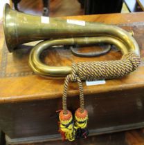 A brass military style bugle