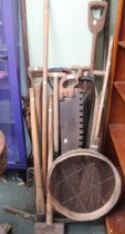 A good selection of mainly wooden shafted garden and hand tools