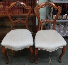 A pair of carved wood Victorian single chairs