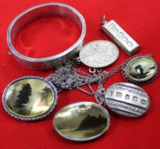 A selection of jewellery, includes two 1977 silver ingot pendants. a silver bangle, together with th