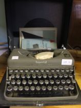 A vintage Imperial "Good Companion" Model T Portable typewriter with original instructions and