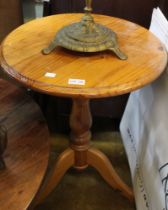 A small pine circular occasional table