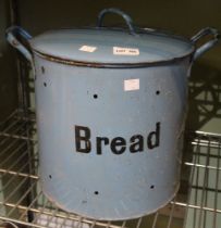 A vintage blue enamelled metal bread bin with lid