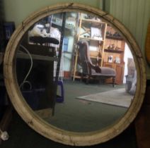 A contemporary large circular mirror with concrete frame, 86cm dia