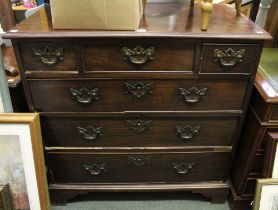 A 19th century chest of three over three drawers brass handles and bracket feet