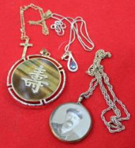 A 9ct gold cross on chain, a 9ct gold stone set pendent on chain, a 9ct gold chain with photograph p