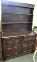 An Old Charm style dark wood dresser