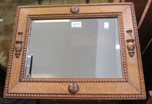 Early 20th craved oak framed bevel edged wall mirror