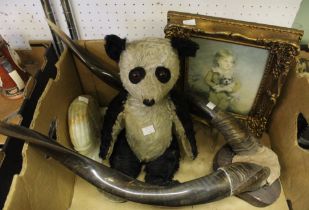 A pair of horns on shields, a pair of book-ends, a print and a panda soft toy