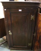 Early 19th century wall hanging oak corner cupboard with butterfly hinges