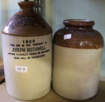 A stoneware vinegar flagon with a stoneware jar